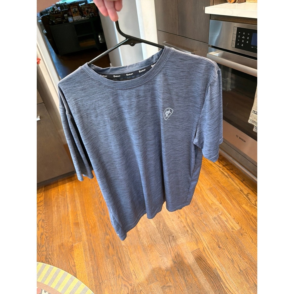 Ariat Men's Charger t-shirt features a small chest logo and moisture-wicking L